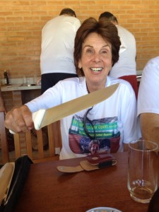Maria gets her hands on one of the long knives at the Churrasco
