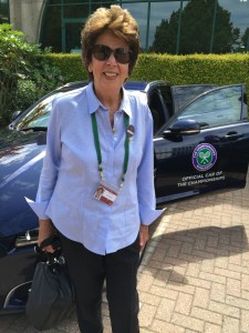 Maria Bueno poses in front of a Wimbledon courtesy car