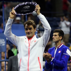 Roger Federer holds up the runners-up trophy at the US Open