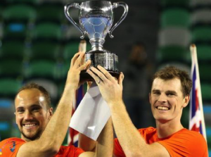 Bruno Soares (left) and Jamie Murray raise the men's doubles trophy in Melbourne