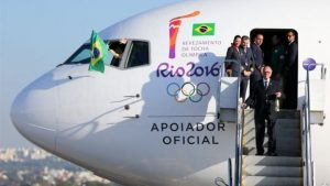 Rio 2016 President Carlos Arthur Guzman carries the Flame onto Brazilian soil.