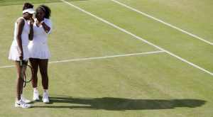 Venus Williams, left, and Serena Williams [AP Photo/Kirsty Wigglesworth]