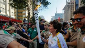 Maria Esther Bueno runs with the Olympic Torch in Sao Paulo