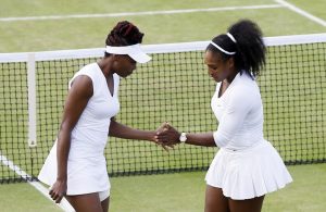 Venus Williams, left, and Serena Williams of the U.s celebrate a point against Lucie Hradecka and Andrea Hlavackova of the Czech Republic during their women's doubles match on day nine of the Wimbledon Tennis Championships in London, Tuesday, July 5, 2016. (AP Photo/Kirsty Wigglesworth)