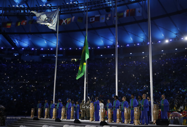 The Brazilian flag is raised [AP Photo/Matt Dunham]