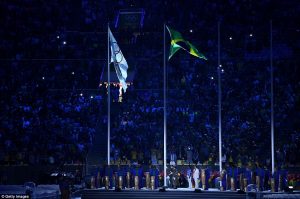 Flying high, the host nation's flag proudly alongside the Olympic flag