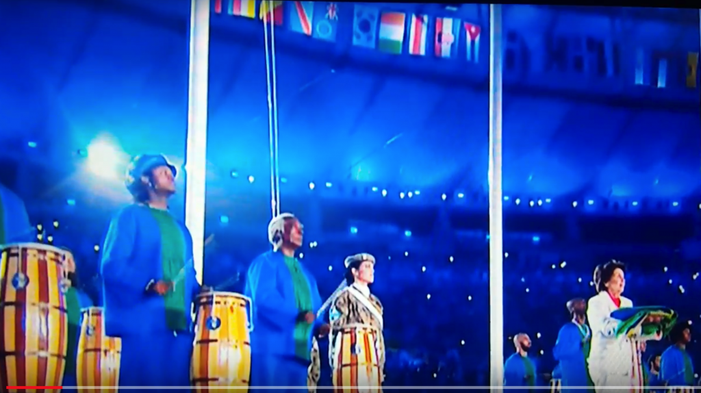 Maria Esther Bueno presents the Brazilian flag