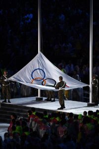 The Olympic Flag is taken down