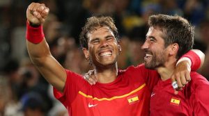 2016 Rio Olympics - Tennis - Final - Men's Doubles Gold Medal Match - Olympic Tennis Centre - Rio de Janeiro, Brazil - 12/08/2016. Rafael Nadal (ESP) of Spain and Marc Lopez (ESP) of Spain celebrate after winning their match against Florin Mergea (ROU) of Romania and Horia Tecau (ROU) of Romania. REUTERS/Kevin Lamarque TPX IMAGES OF THE DAY. FOR EDITORIAL USE ONLY. NOT FOR SALE FOR MARKETING OR ADVERTISING CAMPAIGNS.